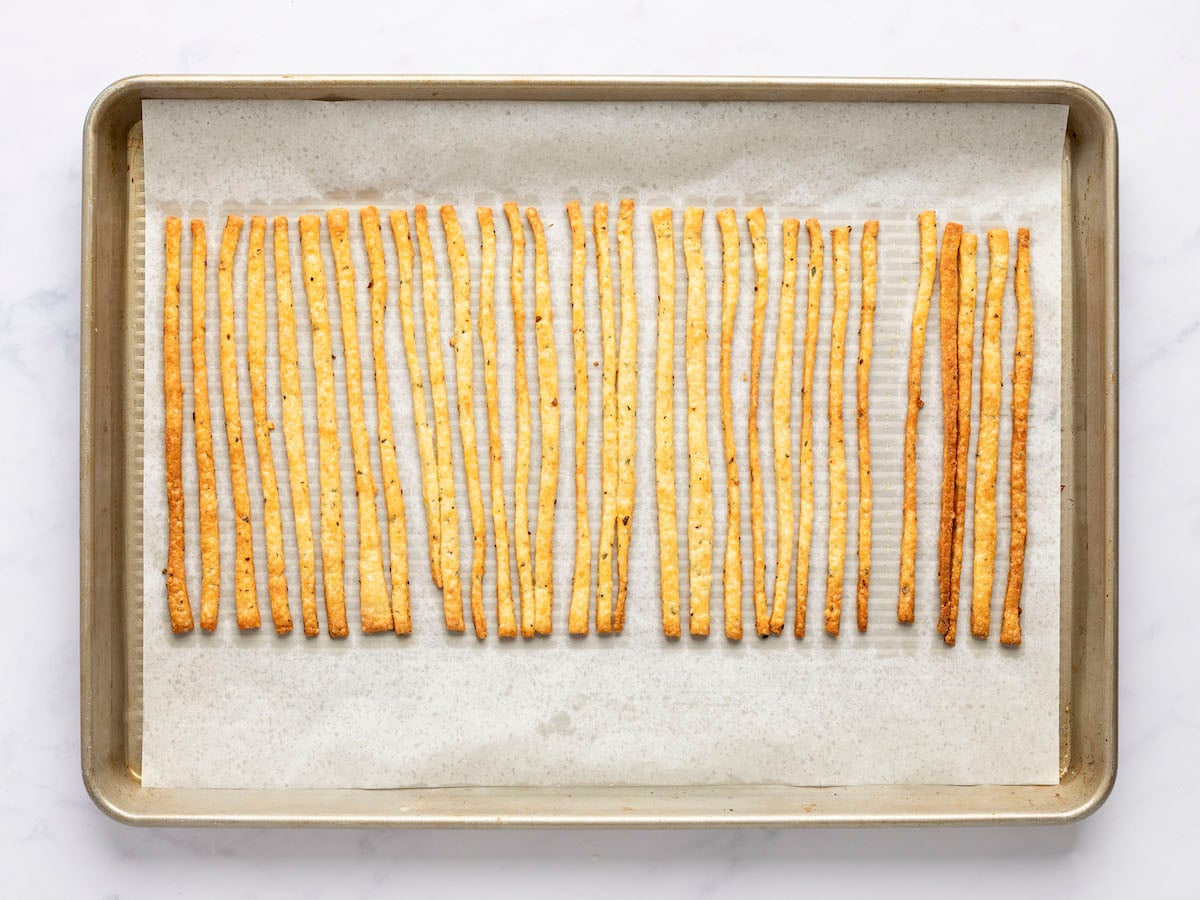 baked cheese straws on baking sheet.