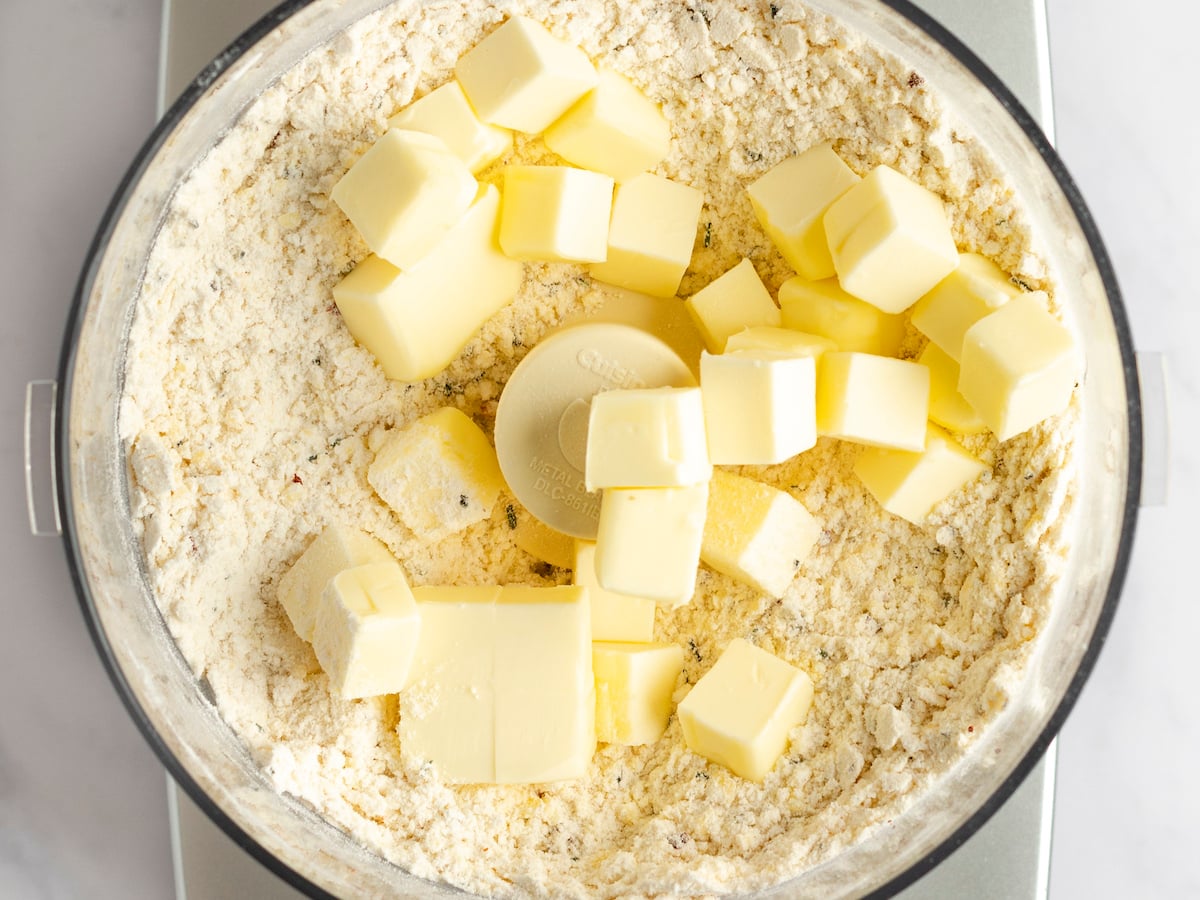 butter cubes added to food processor.