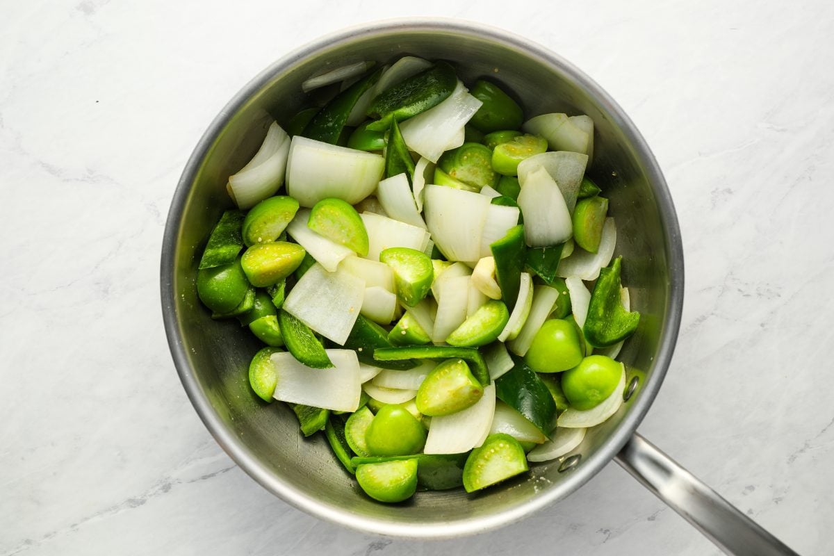 tomatillos, jalapenos, onion, and garlic in pot
