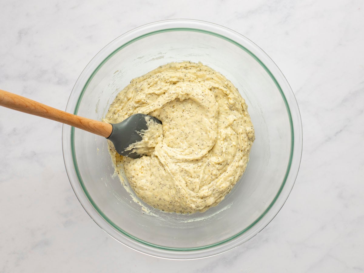 eggs, curdled lemon/mixture and melted butter combined with dry ingredients in large bowl