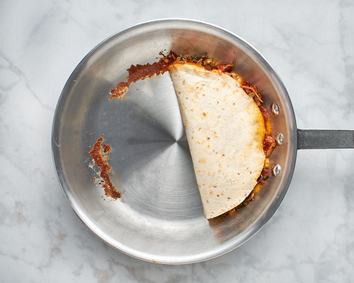folded quesadilla in skillet