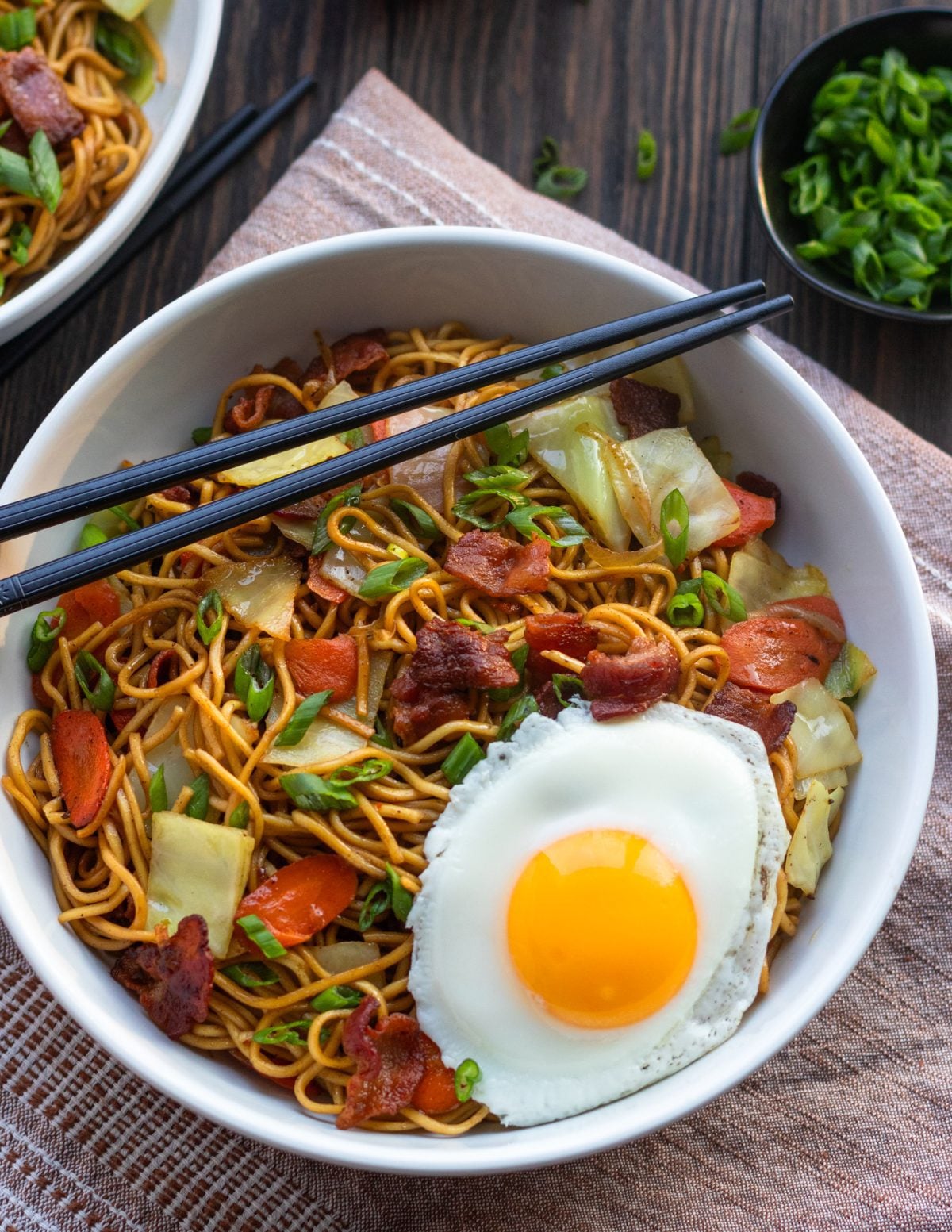 bowl of yakisoba noddles with chopsticks