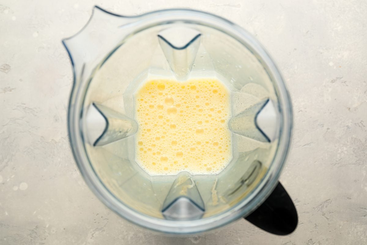 blended broth and egg yolks in blender