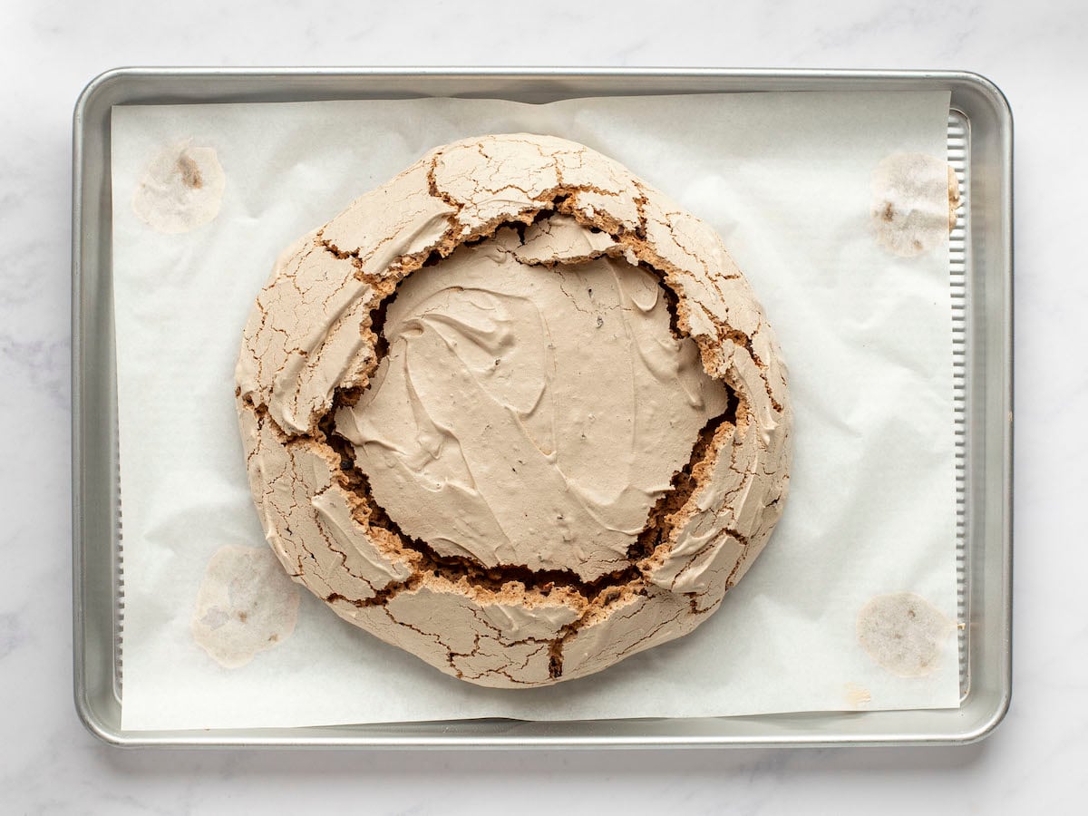 baked chocolate pavlova on baking sheet.