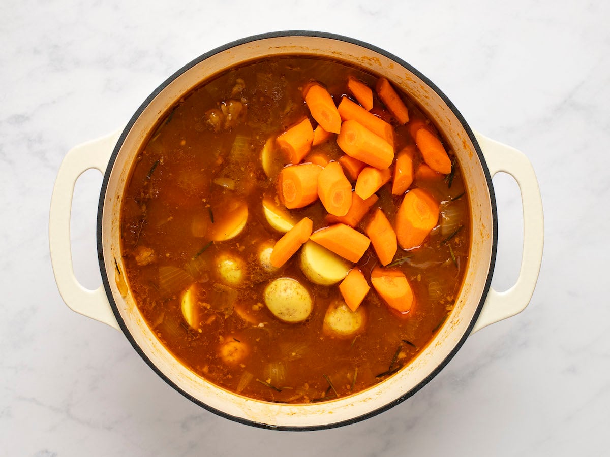 potatoes and carrots added to the partially cooked stew