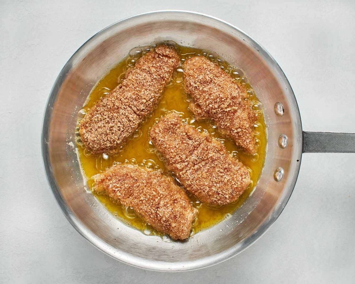 frying the pecan-crusted chicken tenders.