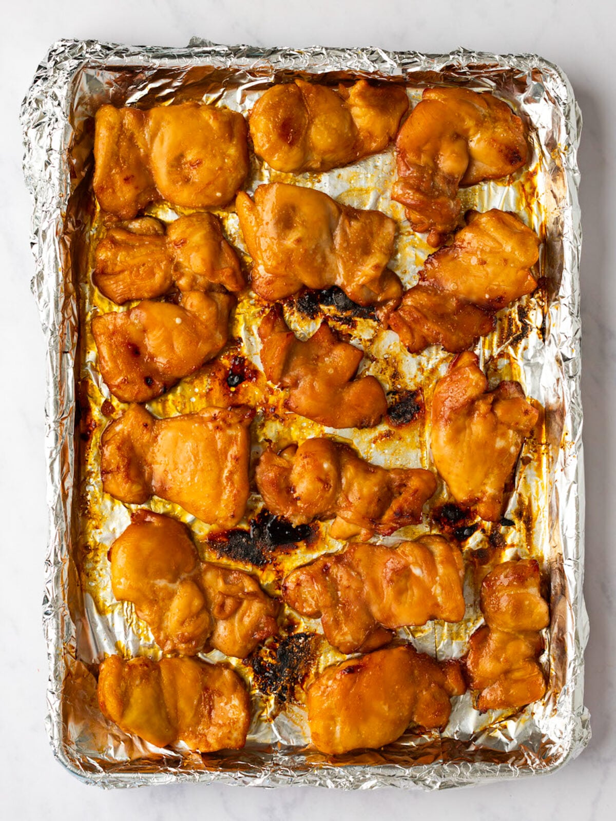 broiled chicken teriyaki on baking sheet