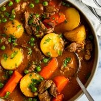 lamb stew in bowl with striped napkin