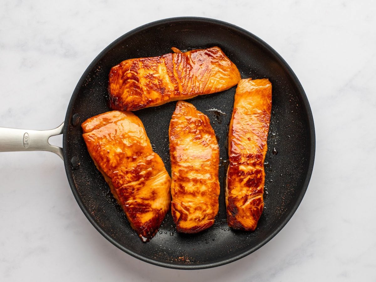 browned teriayki salmon in skillet.