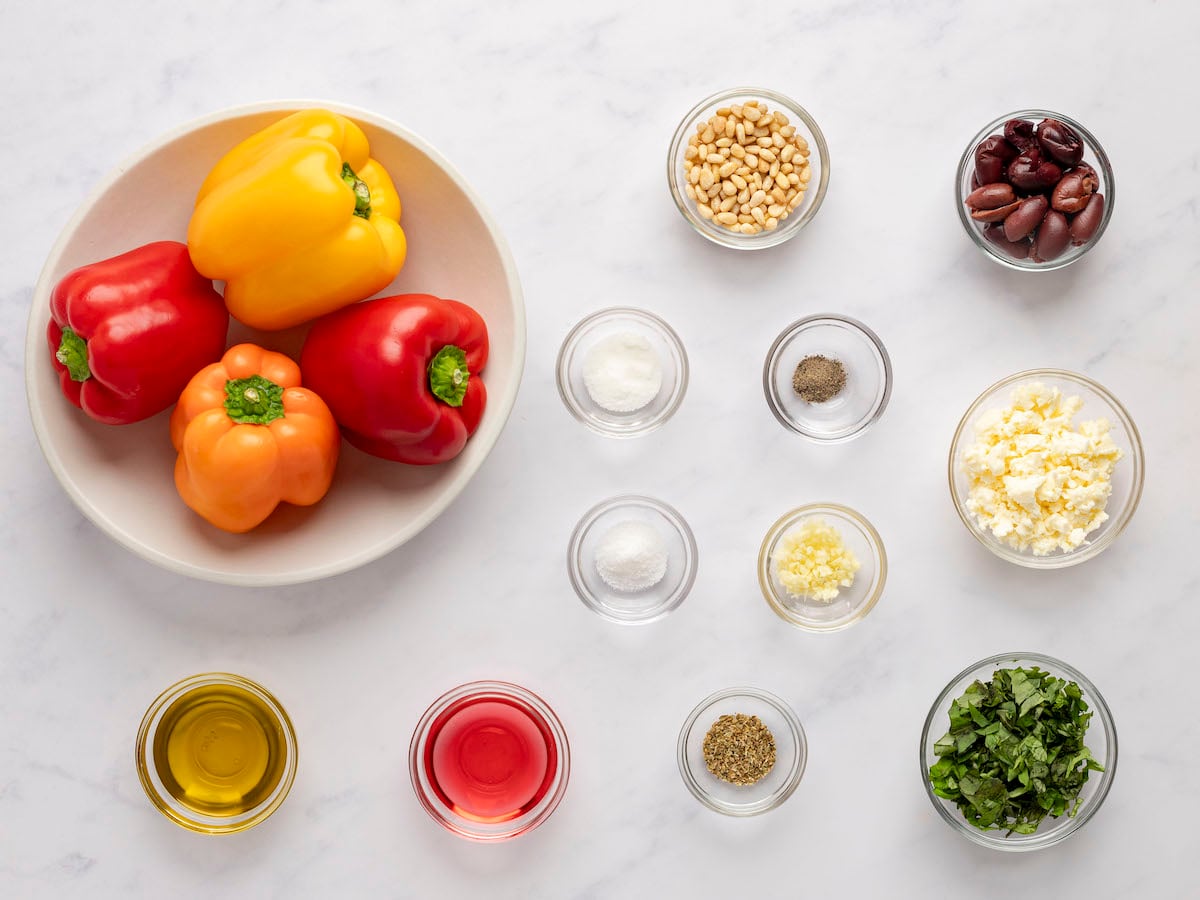 roasted pepper salad ingredients on marble board.