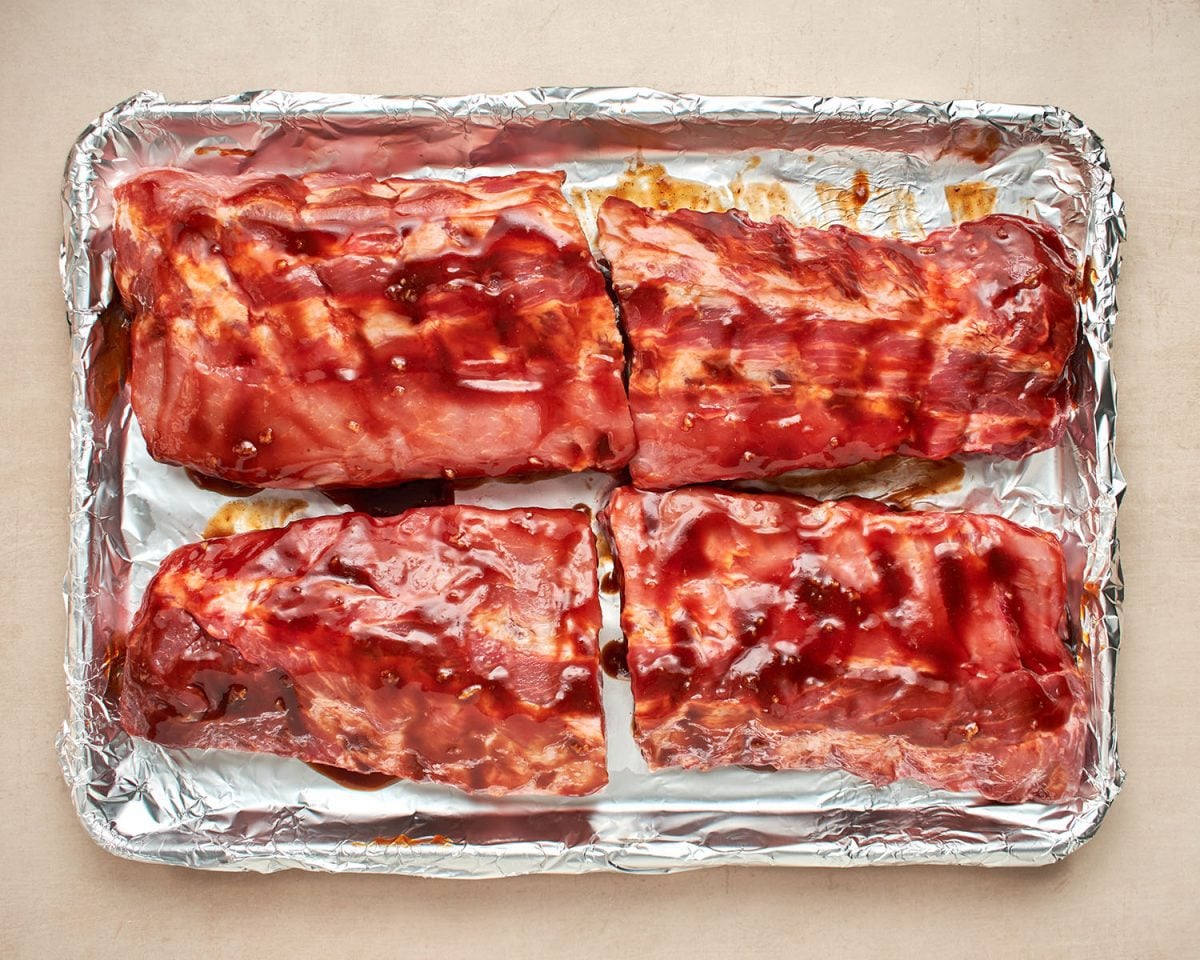 ribs marinating in bbq sauce.