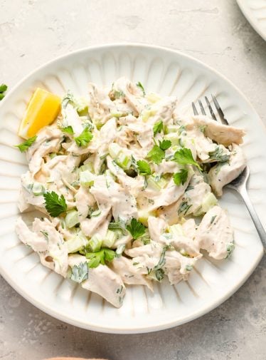 Chicken salad on a plate with fork.