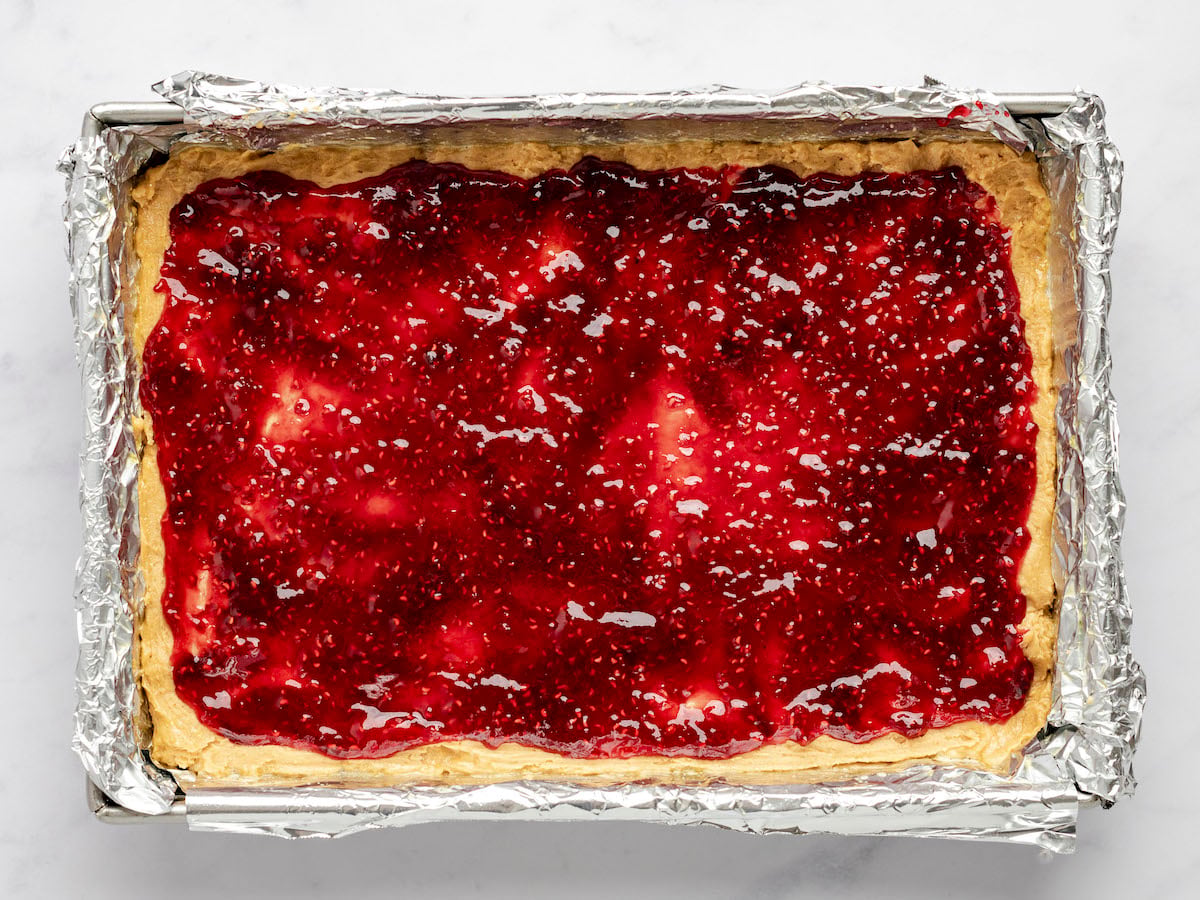 jam spread evenly over dough in the 9x13-inch pan