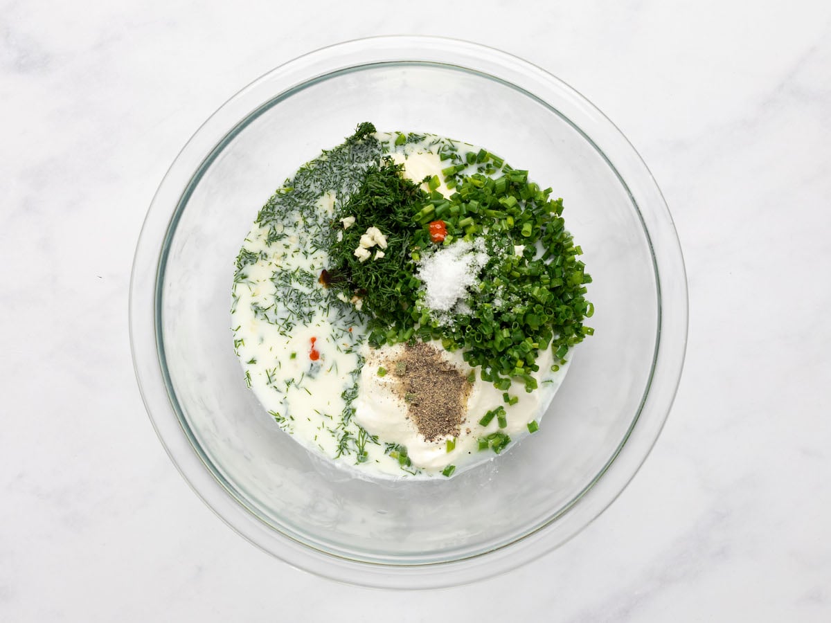 herbs and seasoning added to sour cream and mayo mixture.