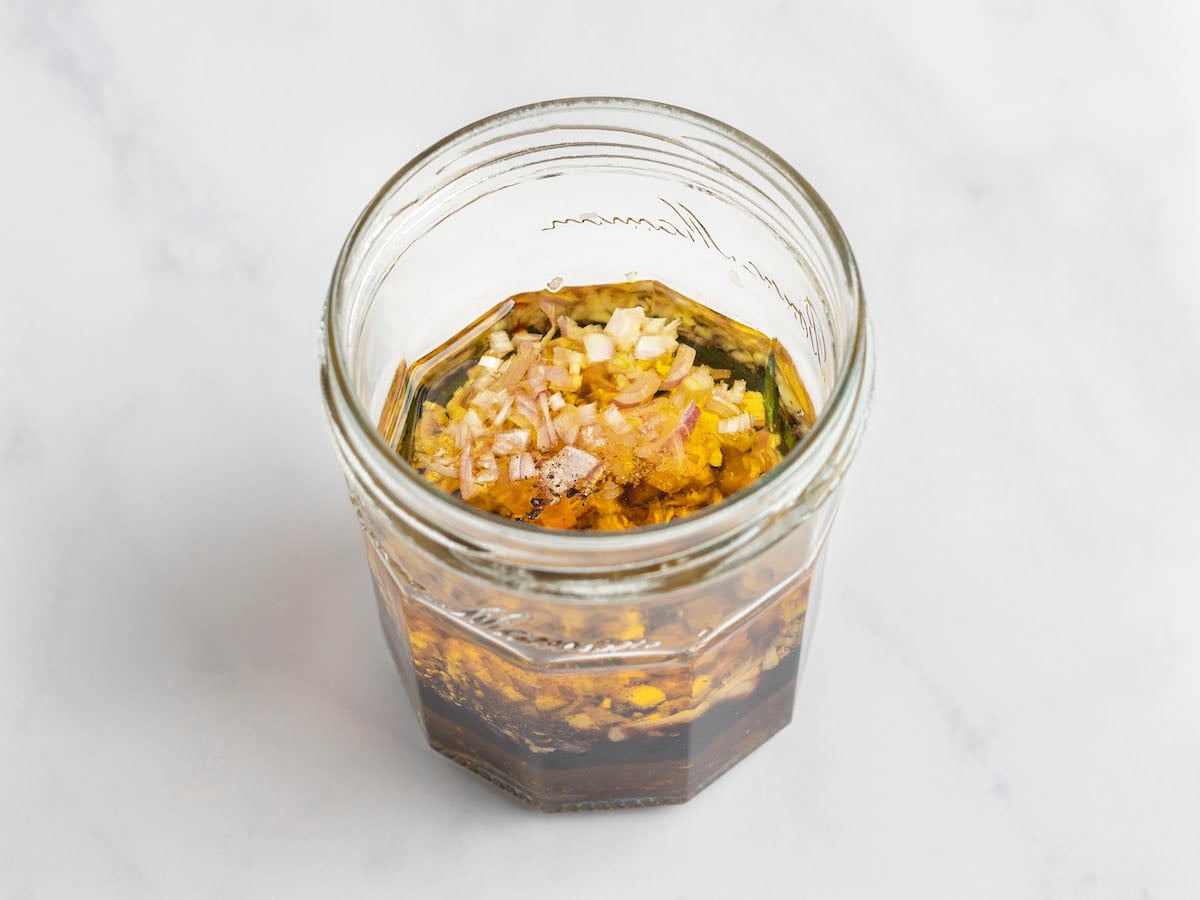 raspberry vinaigrette ingredients combined in jar.