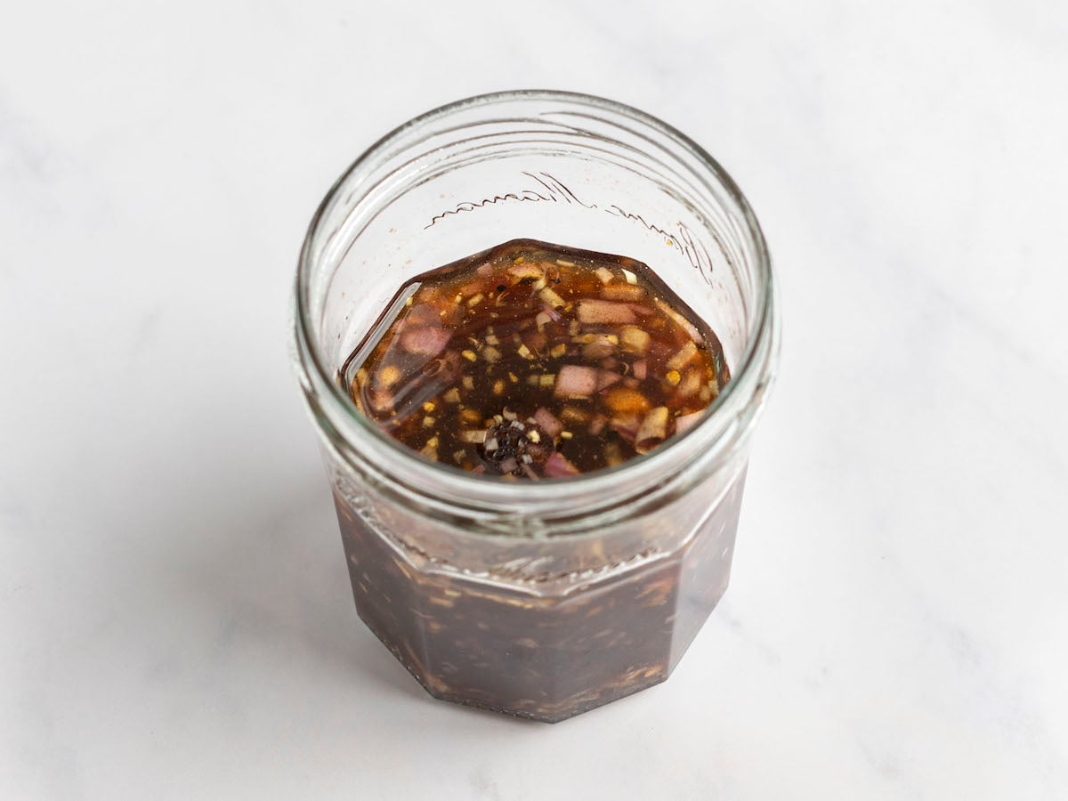 emulsified raspberry vinaigrette in jar.
