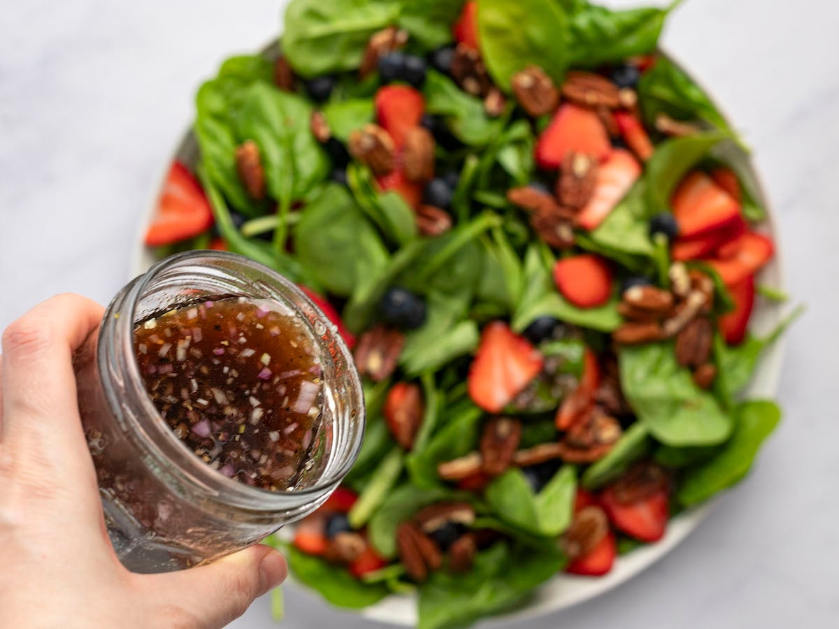 dressing the spinach salad.