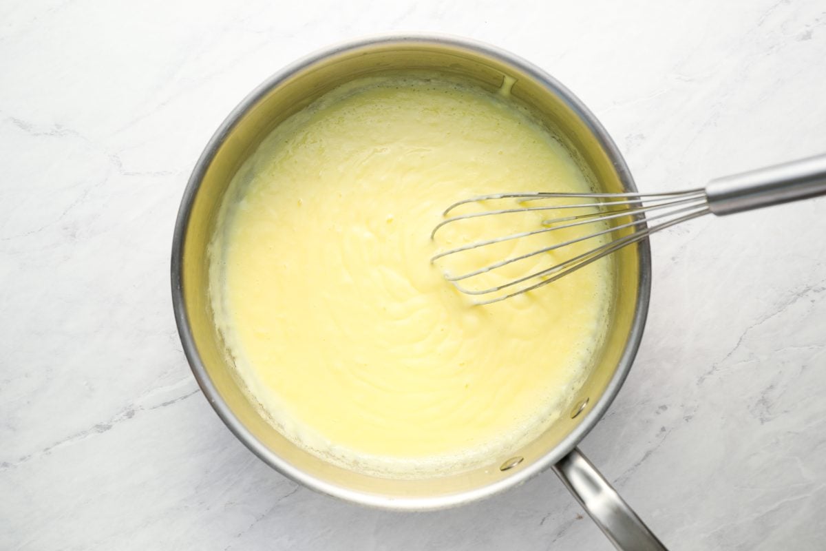 thickened mixture with whisk in heavy sauce pan