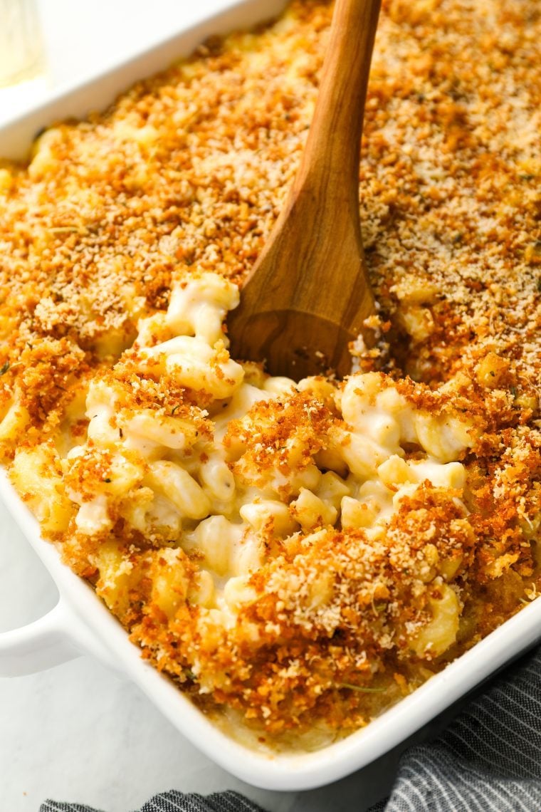 mac and cheese in baking dish with serving spoon