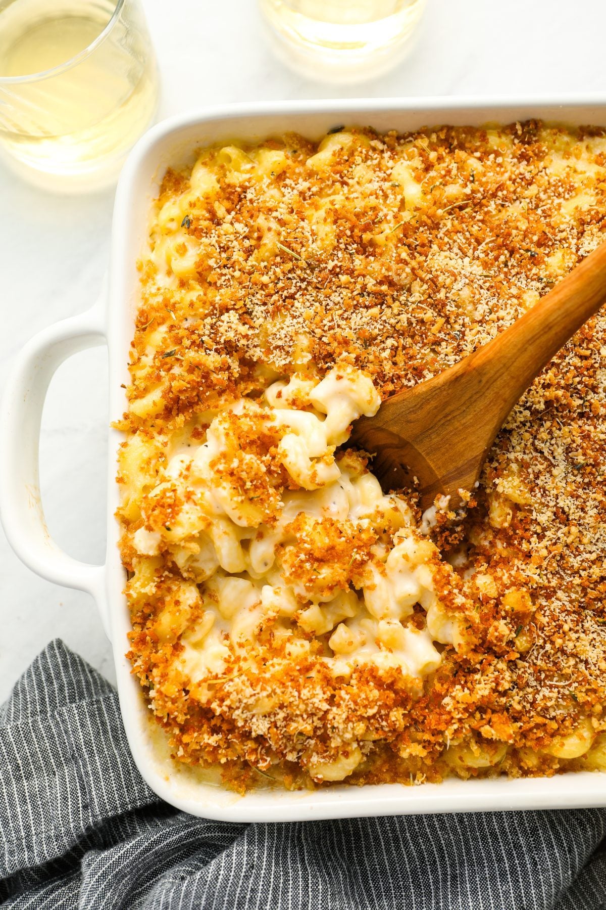 mac and cheese in baking dish with serving spoon