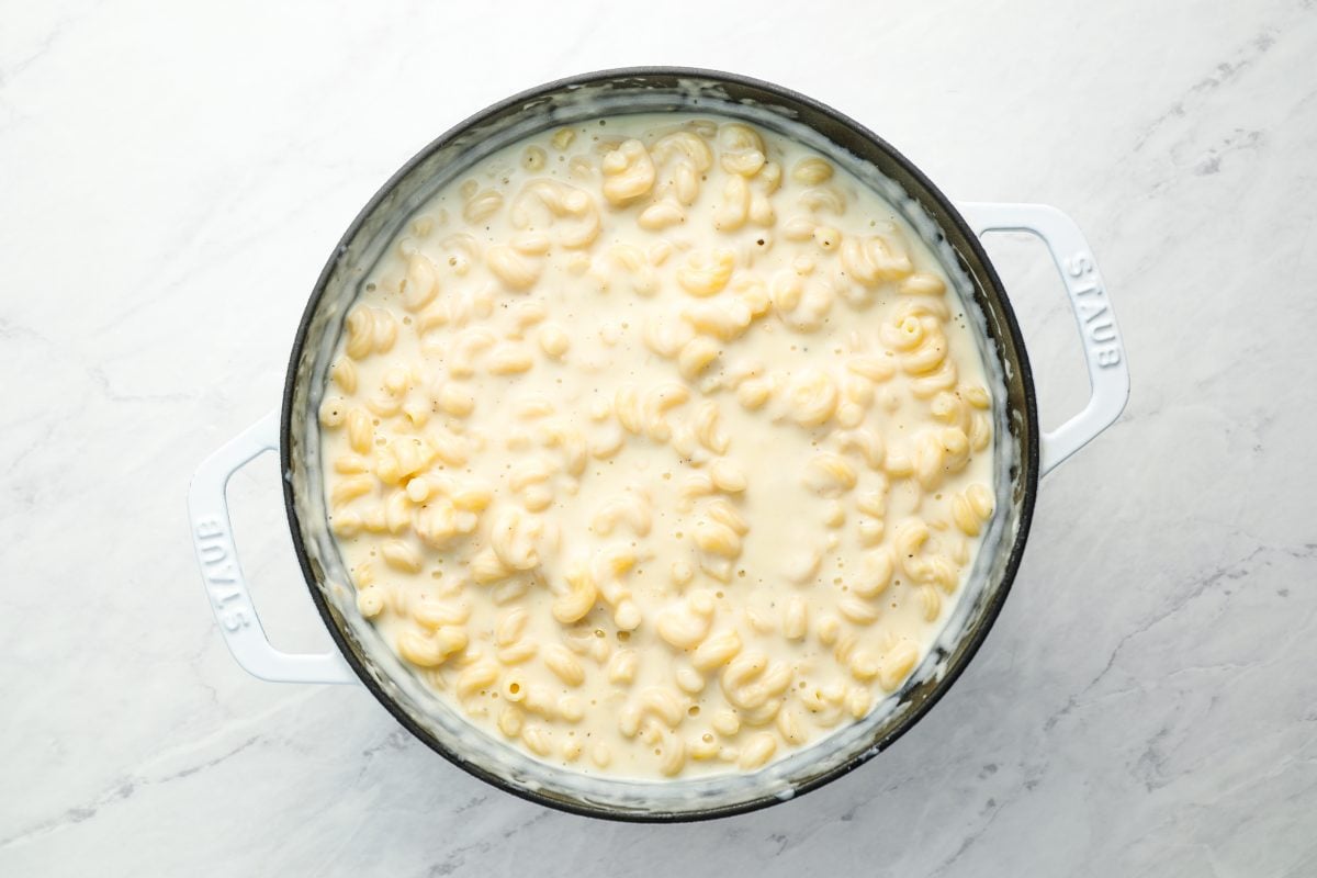 noodles combined with cheese sauce in Dutch oven