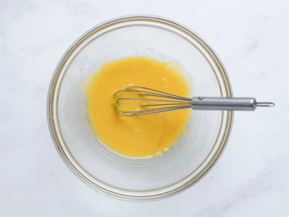melted butter, vanilla, and egg yolk whisked in bowl