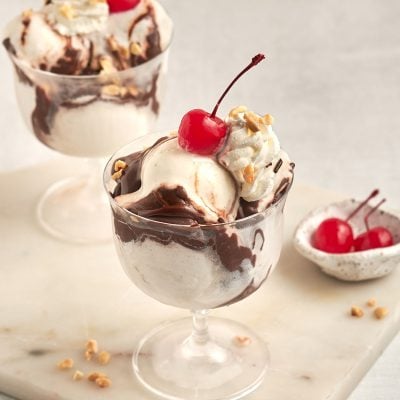 hot fudge sundaes with bowl of cherries
