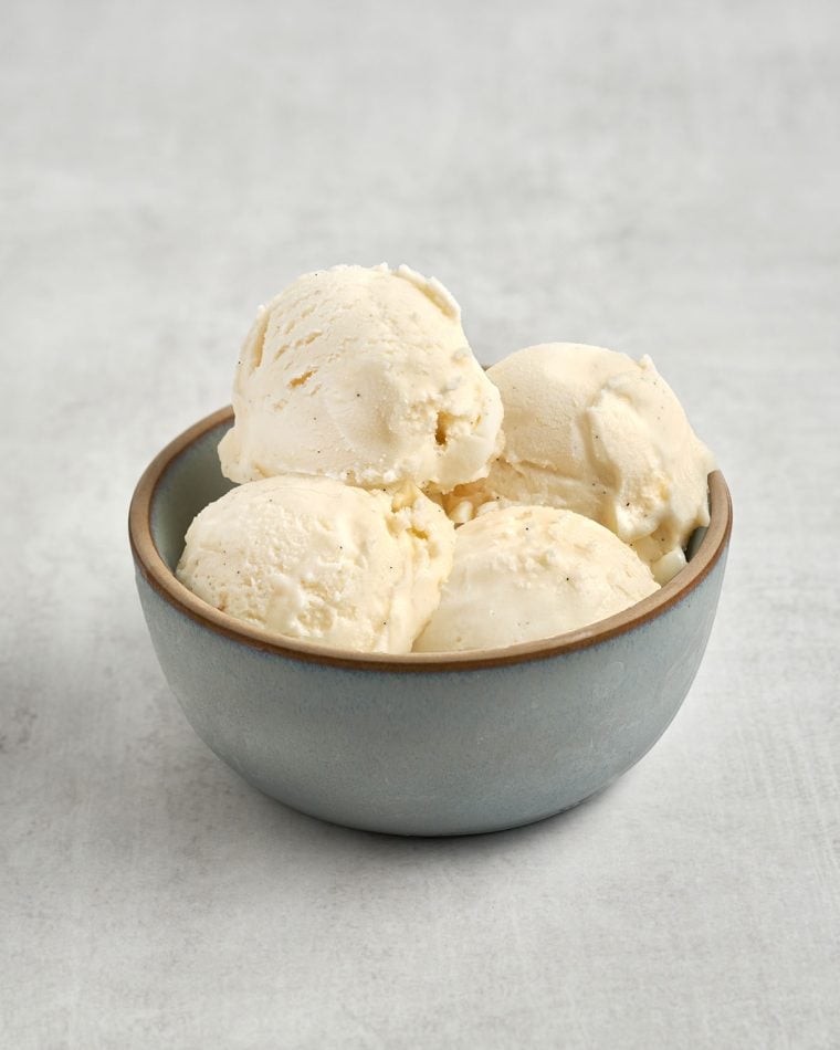 4 scoops of vanilla ice cream in blue bowl