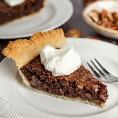 slices of chocolate pecan pie on plates
