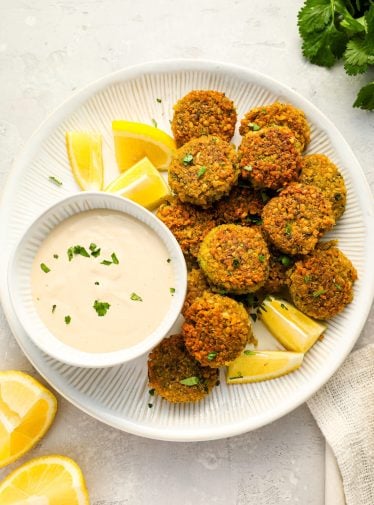 falafel on platter with tahini sauce