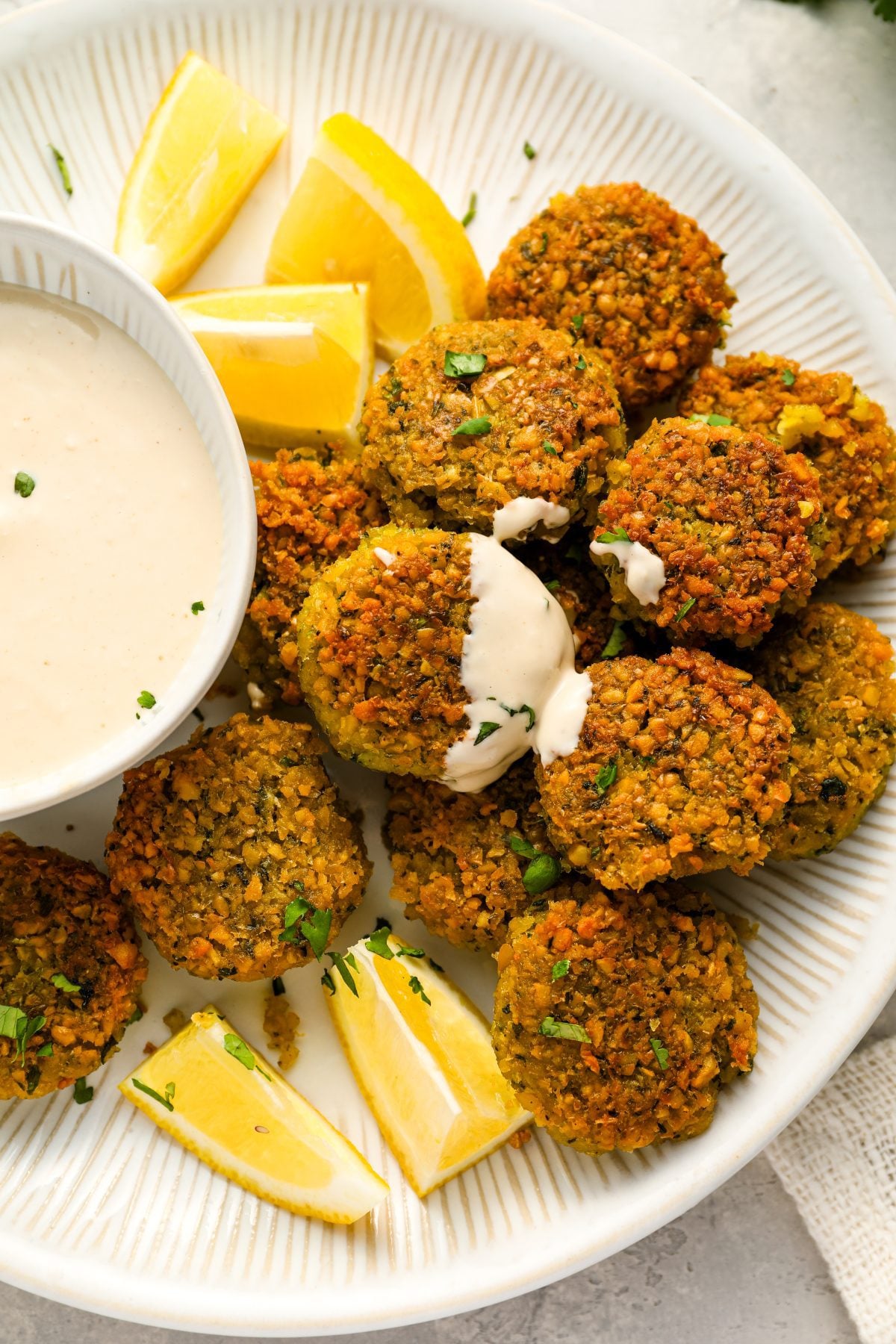 falafel on platter with tahini sauce