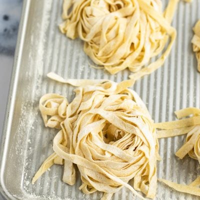 homemade pasta on baking sheet