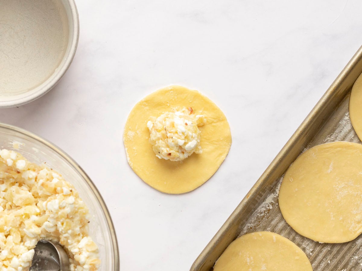 tablespoon of filling in center of one dough disk