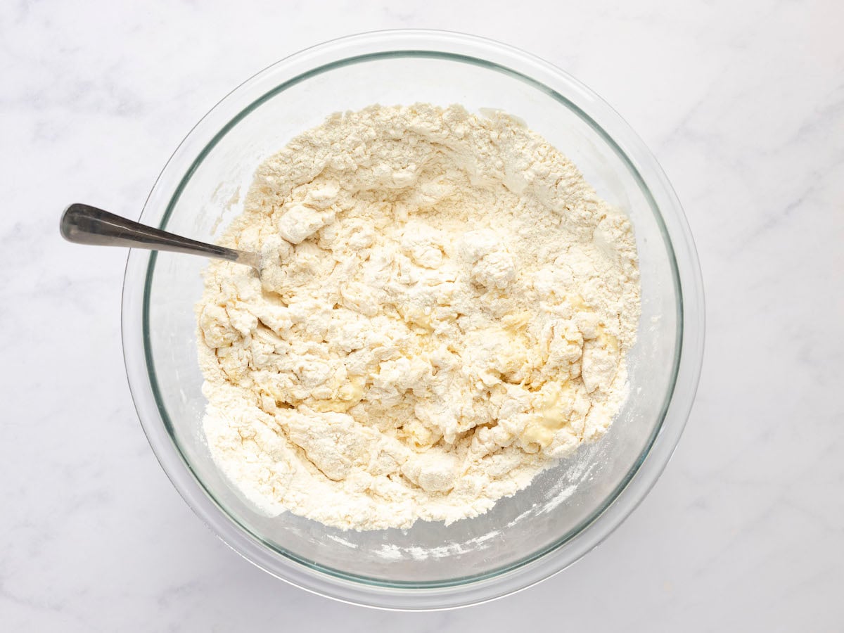 stirring flour mixture and water/egg mixture with a fork