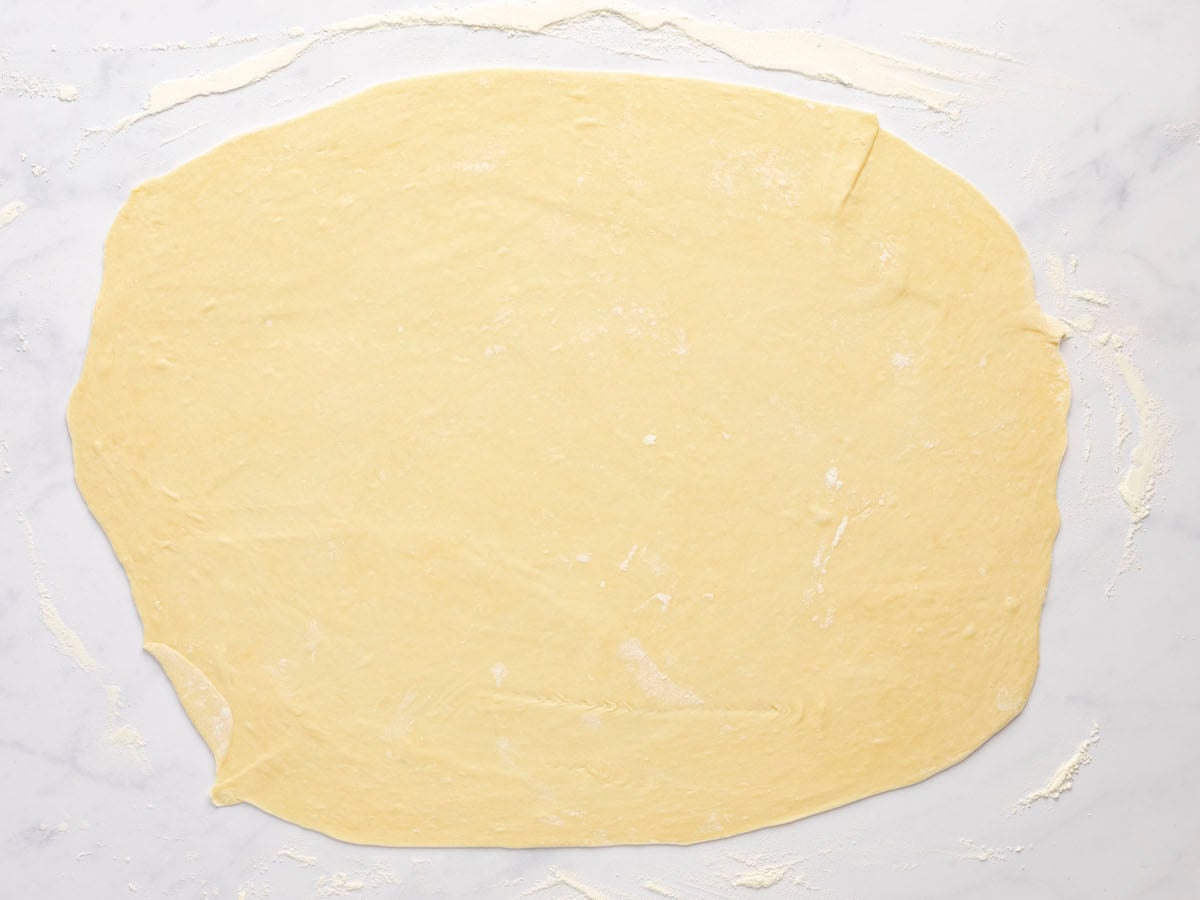 1/2 of the dough rolled out thinly on clean work surface