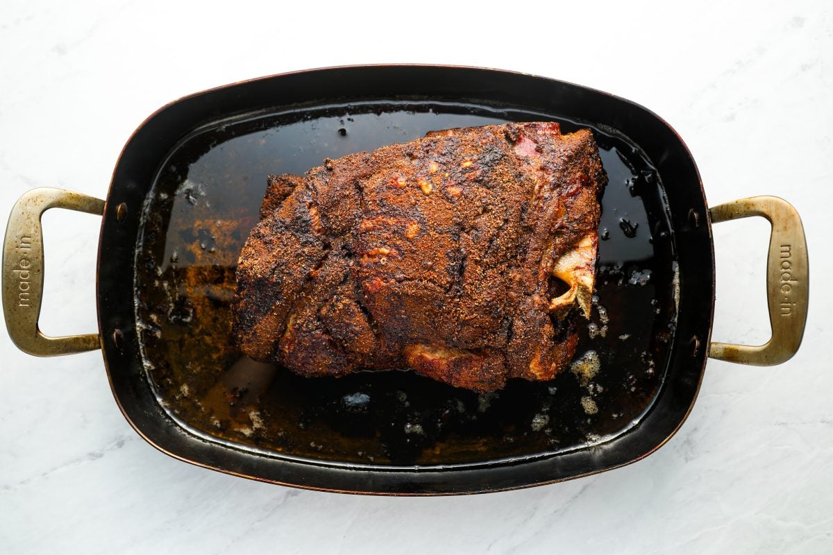 cooked pork butt in roasting pan