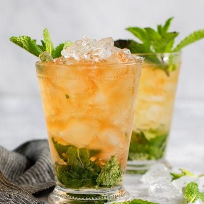 two mint juleps with linen napkin