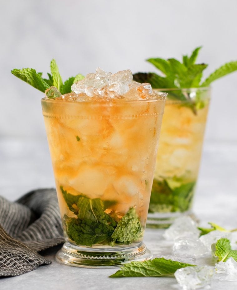 two mint juleps with linen napkin