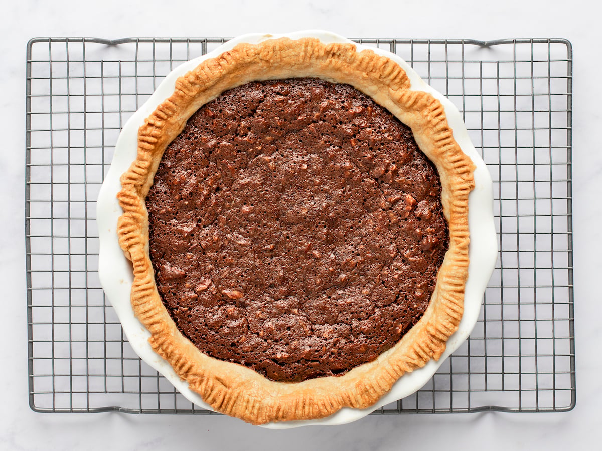 baked chocolate pecan pie on cooling rack