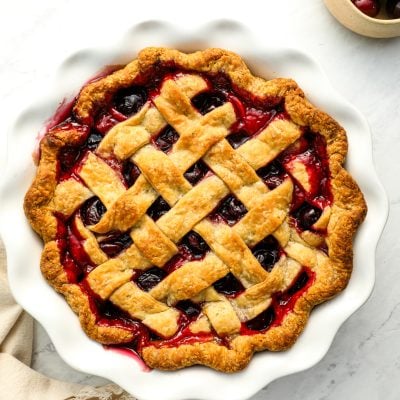 cherry pie with a bowl of cherries
