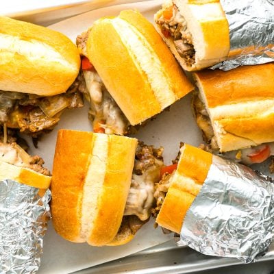 philly cheesesteak sandwiches on sheet pan