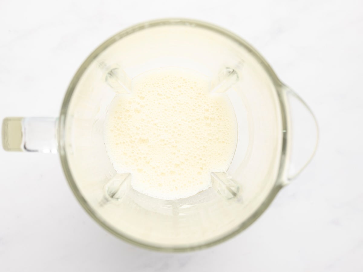 eggs, oil, and milk blended in blender pitcher