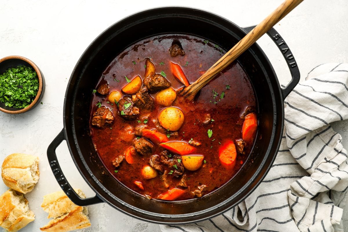 Hungarian goulash in Dutch oven with bread.
