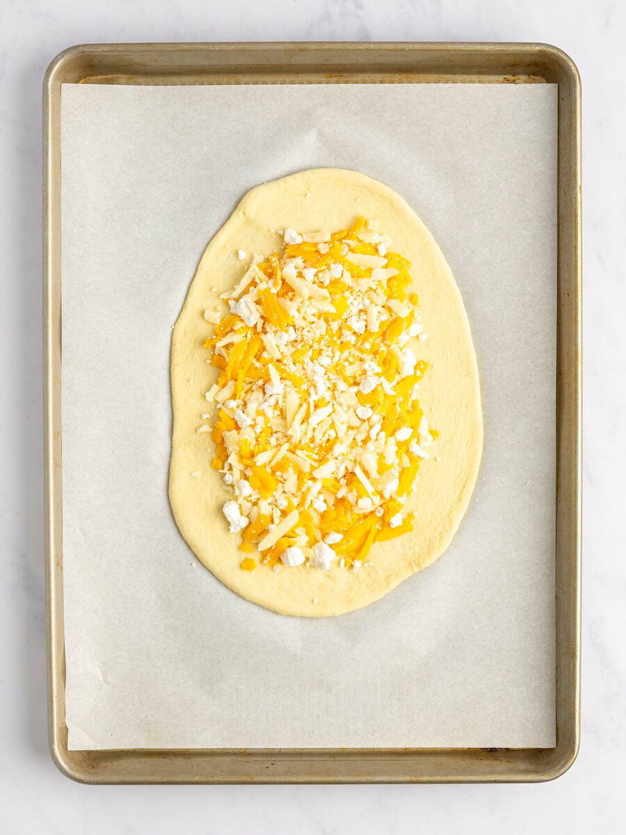 1/4 of cheese mixture in center of dough oval