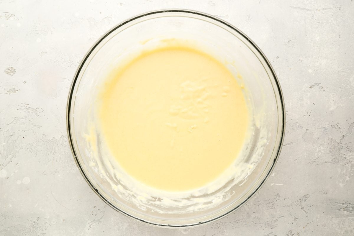flour and milk fully combined with egg/butter mixture in large mixing bowl