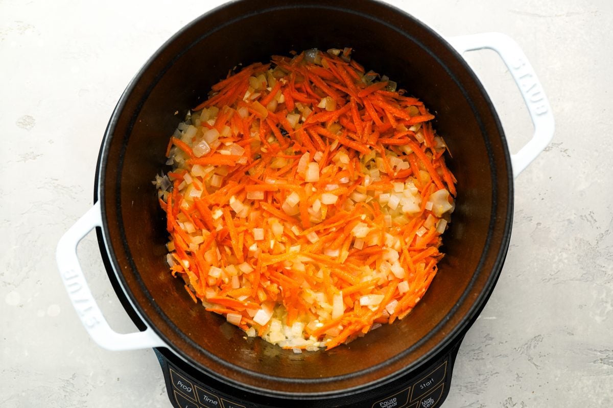 carrots and garlic cooking with onions