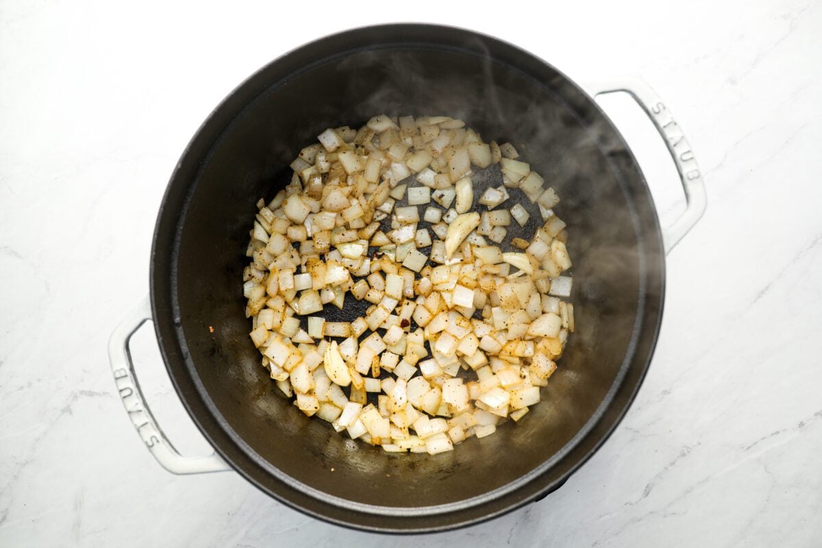 Onion and garlic cooking in dutch oven