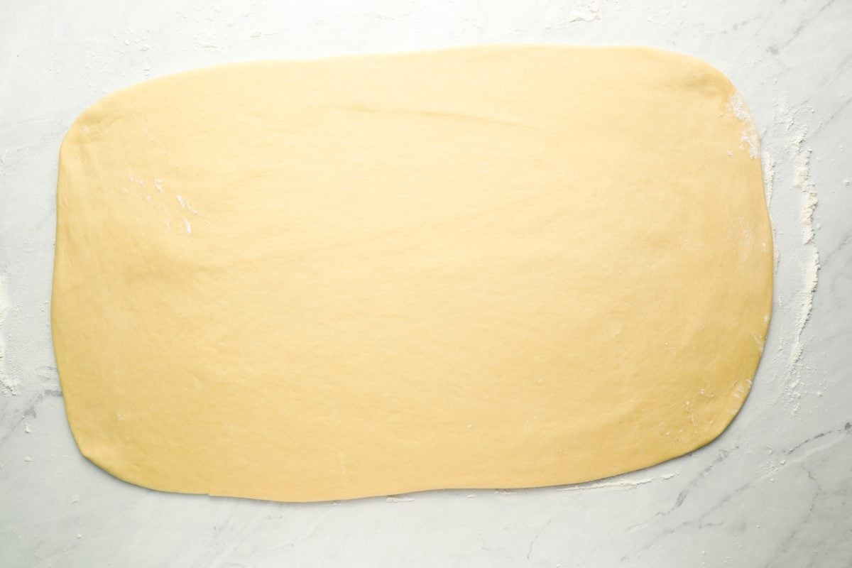 dough rolled into a 12-inch-tall by 22-inch-wide rectangle