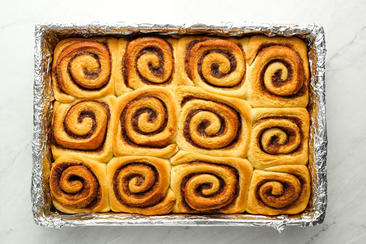 baked cinnamon rolls in baking pan