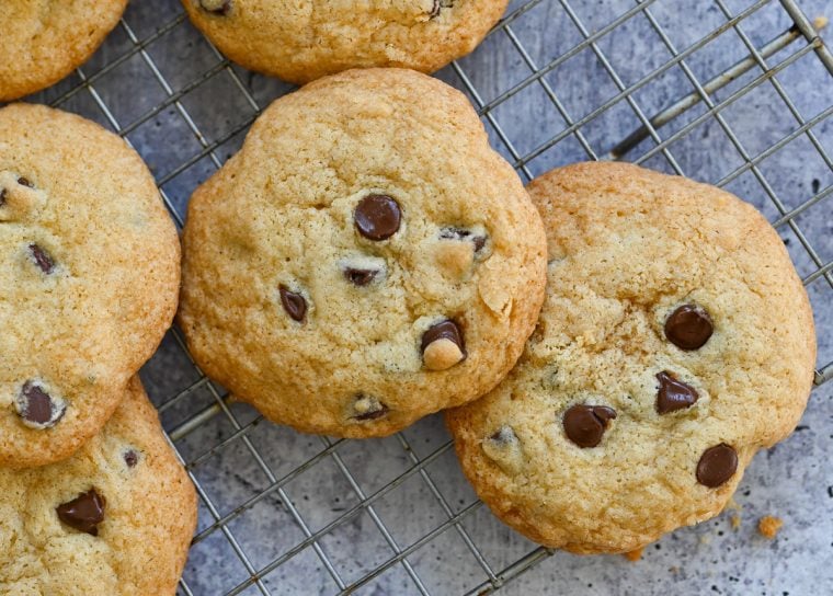 Gluten free chocolate chip cookies cooling on a wire rack.